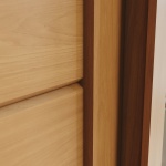 Detail schuifdeur Genius kledingkast in kaneeleiken, elegante en duurzame afwerking
